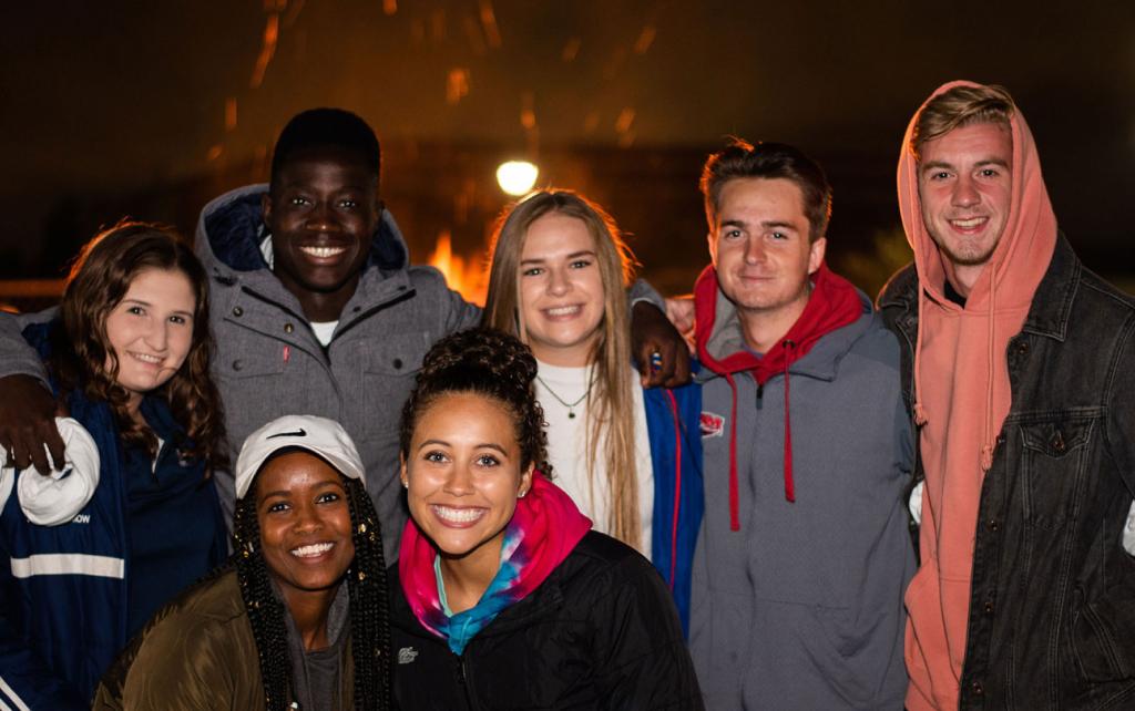 Students at an evening event on the campus mall